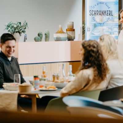 A picture of several people in a meeting.