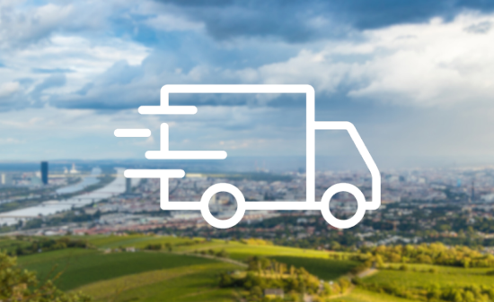 Icon of a truck overlayed on an aerial landscape photo.