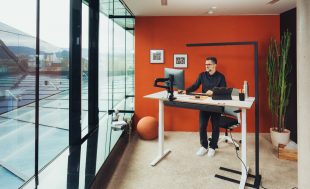 Man working at standing desk